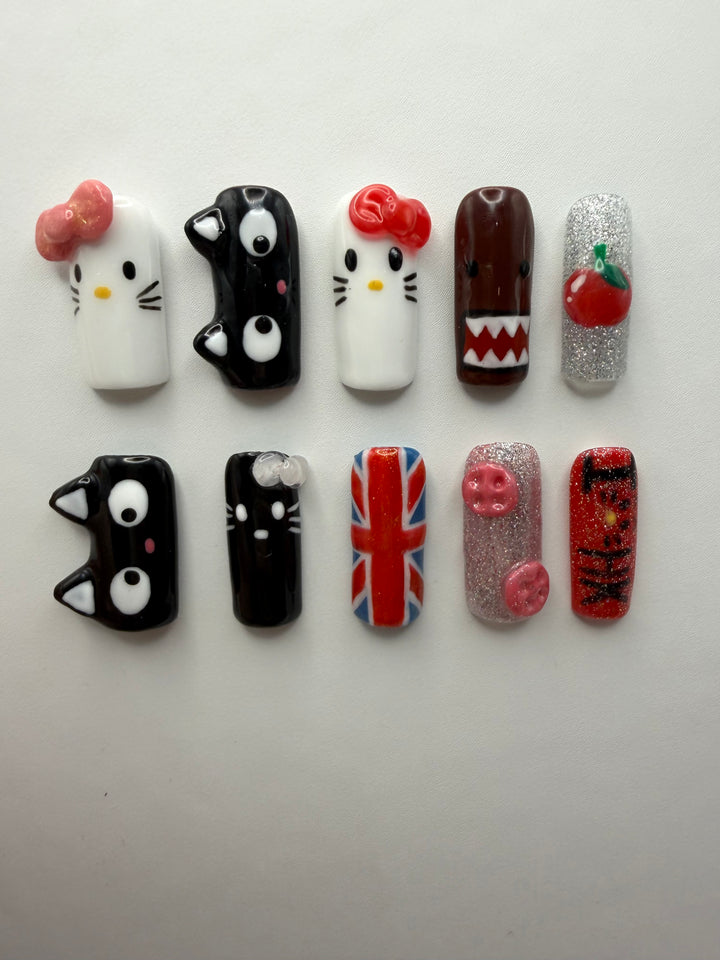 i<3HK press-on nails: ten medium square nails with sculpted bows, black cat faces, a Union Jack, glitter and a cherry charm