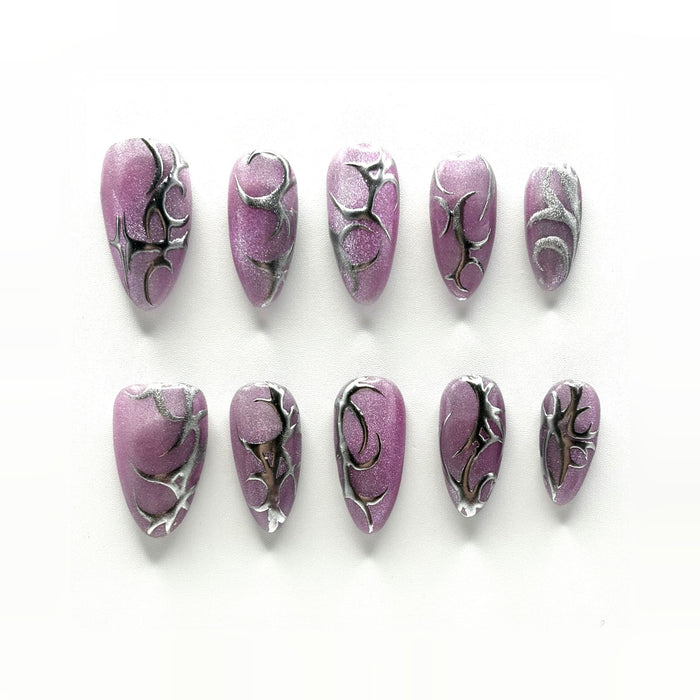 Chrome Thorn press-on nails: mulberry cat-eye chrome almonds with hand-drawn silver thorns, different on every nail